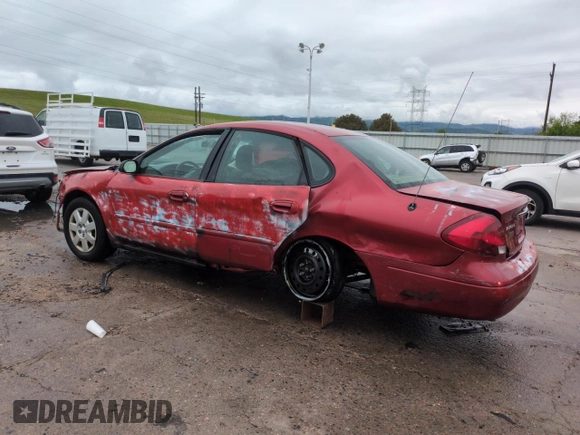 2001 Ford Taurus LX with VIN 1FAFP52UX1A176008, listed as a Copart auction lot 58983935 with 123,985 mi miles and Salvage title. Bid and sale history available at DreamBid. Image 2.