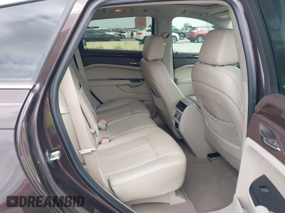 2015 Cadillac SRX Luxury Collection z VIN 3GYFNBE35FS597538, wystawiony jako IAAI lot #42056002 z przebiegiem 49 483 mil mil oraz . Historia ofert i sprzedaży dostępna na DreamBid. Obrazek 8.