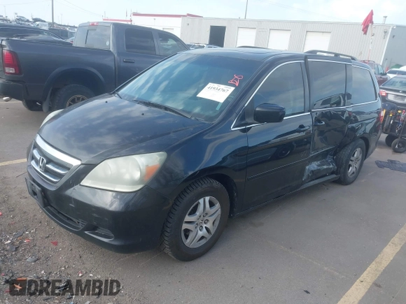 2007 Honda Odyssey EX-L with VIN 5FNRL38627B041332, listed as a IAAI auction lot 41934767 with 234,332 mi miles and . Bid and sale history available at carsss.com. Image 2.