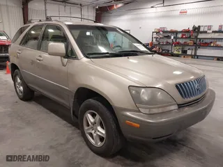 1999 Lexus RX 300 Luxury SUV with VIN JT6HF10U1X0013464, listed as a IAAI auction lot 42088616 with 254,653 mi miles. Bid and sale history available at carsss.com. Image 1.
