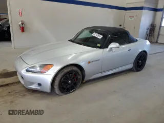 2002 Honda S2000 with VIN JHMAP114X2T009229, listed as a Copart auction lot 82762814 with 103,925 mi miles and Salvage Title. Bid and sale history available at DreamBid. Image 1.