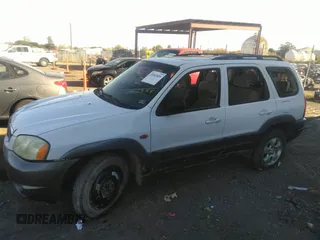 2003 Mazda Tribute LX with VIN 4F2YZ04153KM18168, listed as a IAAI auction lot 39240269 with 225,859 mi miles and . Bid and sale history available at DreamBid. Image 2.
