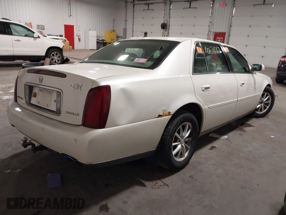 2003 Cadillac DeVille with VIN 1G6KD54Y63U178022, listed as a IAAI auction lot 42076667 with 141,863 mi miles. Bid and sale history available at carsss.com. Image 4.