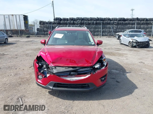 2016 Mazda CX-5 Grand Touring with VIN JM3KE4DY9G0850583, listed as a IAAI auction lot 42075545 with 92,789 mi miles and . Bid and sale history available at carsss.com. Image 12.