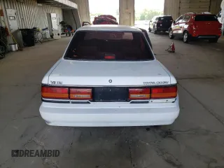 1991 Toyota Camry z VIN 4T1VV21E8MU050409, wystawiony jako Copart lot #61379824 z przebiegiem 100 949 mil mil oraz Nie do naprawy • Non repairable. Historia ofert i sprzedaży dostępna na DreamBid. Obrazek 6.