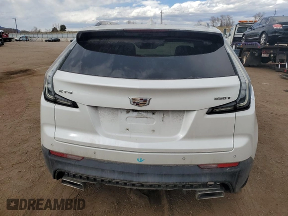 2022 Cadillac XT4 FWD Sport z VIN 1GYFZER47NF165920, wystawiony jako Copart lot #50389935 z przebiegiem 57 410 mil mil oraz Szkoda całkowita • Salvage title. Historia ofert i sprzedaży dostępna na DreamBid. Obrazek 6.
