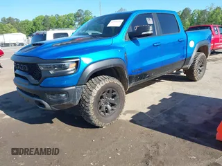 2021 Ram 1500 TRX z VIN 1C6SRFU91MN900450, wystawiony jako IAAI lot #42102724 z przebiegiem 80 071 mil mil oraz . Historia ofert i sprzedaży dostępna na DreamBid. Obrazek 2.