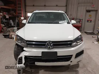 2011 Volkswagen Touareg Sport with VIN WVGFF9BP8BD004747, listed as a IAAI auction lot 41780515 with 159,228 mi miles and . Bid and sale history available at DreamBid. Image 12.