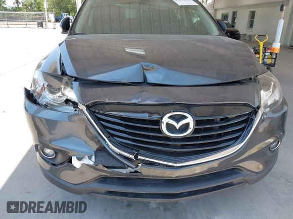2014 Mazda CX-9 Grand Touring z VIN JM3TB2DA0E0434181, wystawiony jako IAAI lot #42295436 z przebiegiem 78 372 mil mil oraz . Historia ofert i sprzedaży dostępna na DreamBid. Obrazek 6.