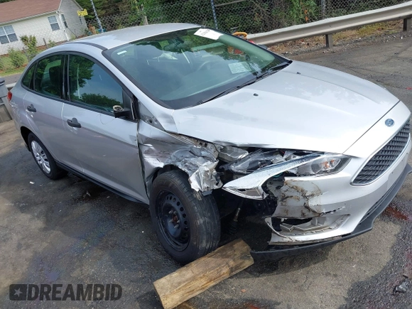 2017 Ford Focus S z VIN 1FADP3E21HL241557, wystawiony jako IAAI lot #42100036 z przebiegiem 106 764 mil mil oraz . Historia ofert i sprzedaży dostępna na DreamBid. Obrazek 1.