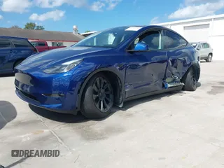 2023 Tesla Model Y Long Range with VIN 7SAYGDEE9PA205757, listed as a IAAI auction lot 41705881 with 18,567 mi miles and . Bid and sale history available at carsss.com. Image 17.