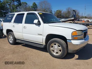 2002 GMC Yukon SLT with VIN 1GKEC13Z02J244875, listed as a IAAI auction lot 41657514 with 329,288 mi miles. Bid and sale history available at carsss.com. Image 1.