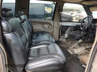 1996 GMC Suburban z VIN 3GKEC16R1TG516669, wystawiony jako Copart lot #69262744 z przebiegiem Nie podano mil oraz Szkoda całkowita • Salvage title. Historia ofert i sprzedaży dostępna na DreamBid. Obrazek 11.