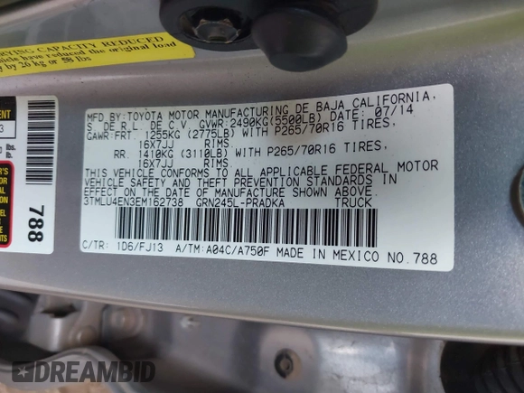 2014 Toyota Tacoma with VIN 3TMLU4EN3EM162738, listed as a IAAI auction lot 41871226 with 135,318 mi miles and . Bid and sale history available at DreamBid. Image 9.