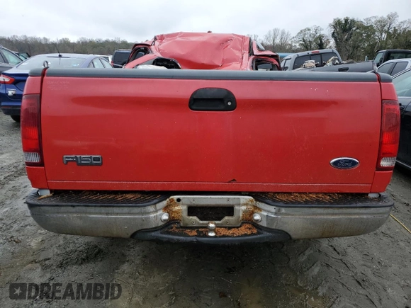 1999 Ford F-150 with VIN 1FTRX17W3XNA26575, listed as a Copart auction lot 81508484 with 138,704 mi miles and Salvage title. Bid and sale history available at DreamBid. Image 6.