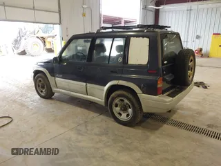 1997 Suzuki Sidekick z VIN JS3TD21V6V4105151, wystawiony jako IAAI lot #41805371 z przebiegiem 126 588 mil mil oraz . Historia ofert i sprzedaży dostępna na DreamBid. Obrazek 3.