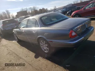 2004 Jaguar XJ with VIN SAJWA71C74SG34056, listed as a Copart auction lot 80083014 with 0 mi miles and Salvage Title. Bid and sale history available at carsss.com. Image 2.