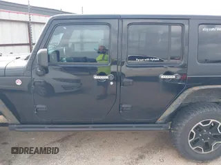 2015 Jeep Wrangler Unlimited Rubicon z VIN 1C4BJWFG2FL572417, wystawiony jako IAAI lot #41895927 z przebiegiem 54 981 mil mil oraz . Historia ofert i sprzedaży dostępna na DreamBid. Obrazek 14.