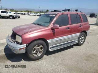 2001 Chevrolet Tracker LT with VIN 2CNBE634116913317, listed as a Copart auction lot 64655005 with 215,011 mi miles and Salvage title. Bid and sale history available at DreamBid. Image 1.