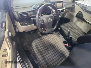 2012 Scion iQ z VIN JTNJJXB04CJ012587, wystawiony jako Copart lot #58191845 z przebiegiem 104 601 mil mil oraz Szkoda całkowita • Salvage title. Historia ofert i sprzedaży dostępna na DreamBid. Obrazek 8.