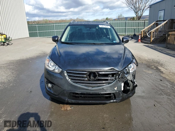 2016 Mazda CX-5 Grand Touring with VIN JM3KE4DY0G0679190, listed as a Copart auction lot 53619495 with 154,649 mi miles and Salvage Title. Bid and sale history available at carsss.com. Image 5.