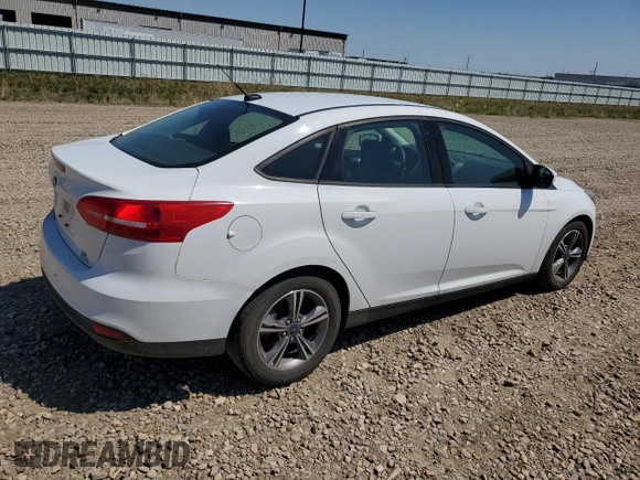 2018 Ford Focus SE with VIN 1FADP3FE0JL227146, listed as a Copart auction lot 56151985 with 124,517 mi miles and Salvage title. Bid and sale history available at DreamBid. Image 3.