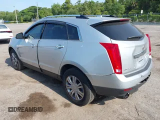 2014 Cadillac SRX Luxury Collection z VIN 3GYFNEE36ES652353, wystawiony jako IAAI lot #42233986 z przebiegiem 146 029 mil mil oraz . Historia ofert i sprzedaży dostępna na DreamBid. Obrazek 3.