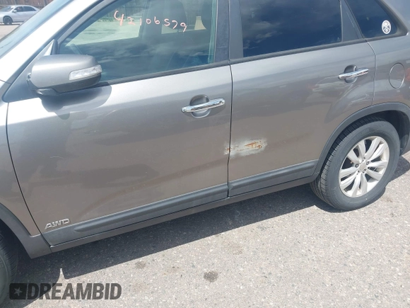 2011 Kia Sorento EX with VIN 5XYKUDA29BG010219, listed as a IAAI auction lot 42106579 with 233,350 mi miles. Bid and sale history available at carsss.com. Image 6.