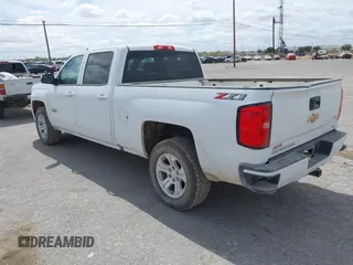 2018 Chevrolet Silverado 1500 LT with VIN 1GCUKREC5JF133998, listed as a IAAI auction lot 41880805 with 166,258 mi miles and . Bid and sale history available at DreamBid. Image 3.