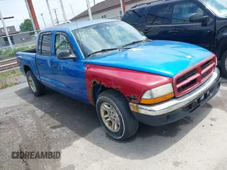 2001 Dodge Dakota Sport z VIN 1B7GL2AN31S115001, wystawiony jako IAAI lot #42452634 z przebiegiem Nie podano mil oraz . Historia ofert i sprzedaży dostępna na DreamBid. Obrazek 1.