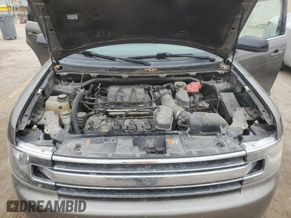 2013 Ford Flex SEL z VIN 2FMGK5C89DBD37239, wystawiony jako Copart lot #86277644 z przebiegiem 127 866 mil mil oraz Szkoda całkowita • Salvage title. Historia ofert i sprzedaży dostępna na DreamBid. Obrazek 12.