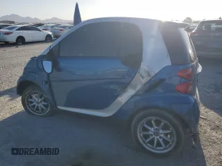 2009 Smart fortwo Pure z VIN WMEEJ31X39K273968, wystawiony jako Copart lot #56888045 z przebiegiem 125 138 mil mil oraz Szkody całkowita. Historia ofert i sprzedaży dostępna na DreamBid. Obrazek 2.