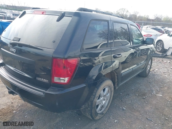 2009 Jeep Grand Cherokee Laredo with VIN 1J8GS48K59C548330, listed as a IAAI auction lot 41887548 with 184,434 mi miles. Bid and sale history available at carsss.com. Image 4.