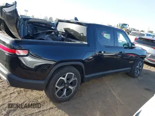 2023 Rivian R1T Adventure with VIN 7FCTGAAAXPN022097, listed as a IAAI auction lot 41235625 with 11,210 mi miles. Bid and sale history available at carsss.com. Image 14.