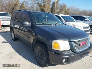 2005 GMC Envoy SLE with VIN 1GKDS13S952304877, listed as a IAAI auction lot 41474232 with 173,676 mi miles. Bid and sale history available at carsss.com. Image 1.