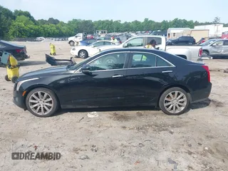 2014 Cadillac ATS Luxury AWD z VIN 1G6AH5RX1E0164796, wystawiony jako IAAI lot #42211010 z przebiegiem 167 079 mil mil oraz . Historia ofert i sprzedaży dostępna na DreamBid. Obrazek 14.