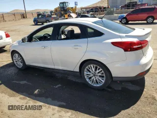 2015 Ford Focus Titanium with VIN 1FADP3J23FL300126, listed as a Copart auction lot 54434165 with 176,526 mi miles and Salvage title. Bid and sale history available at DreamBid. Image 2.