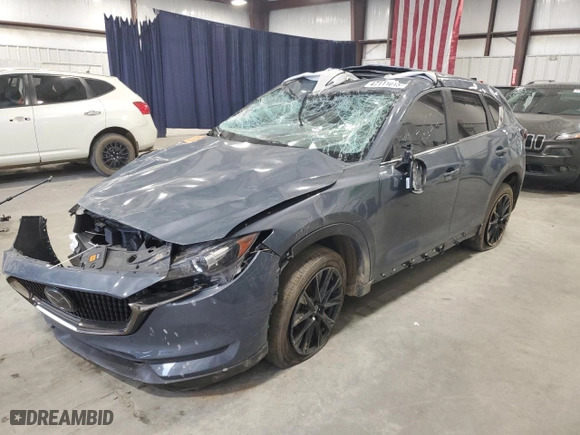 2021 Mazda CX-5 Touring with VIN JM3KFACM1M0422707, listed as a Copart auction lot 47111015 with 36,206 mi miles and Salvage Title. Bid and sale history available at carsss.com. Image 1.