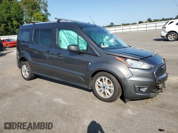 2021 Ford Transit Connect XLT with VIN NM0GS9F27M1504144, listed as a Copart auction lot 70214034 with 45,827 mi miles and Salvage title. Bid and sale history available at DreamBid. Image 4.