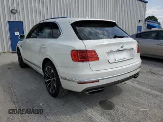 2019 Bentley Bentayga V8 z VIN SJAAM2ZV0KC026362, wystawiony jako Copart lot #54059393 z przebiegiem 31 530 mil mil oraz . Historia ofert i sprzedaży dostępna na DreamBid. Obrazek 2.