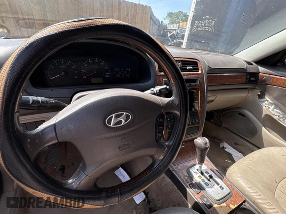 2005 Hyundai XG z VIN KMHFU45E95A381631, wystawiony jako Copart lot #57705005 z przebiegiem 202 730 mil mil oraz Tytuł czysty. Historia ofert i sprzedaży dostępna na DreamBid. Obrazek 9.