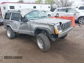 2000 Jeep Cherokee z VIN 1J4FF48S3YL123298, wystawiony jako IAAI lot #42113673 z przebiegiem 206 084 mil mil oraz . Historia ofert i sprzedaży dostępna na DreamBid. Obrazek 1.