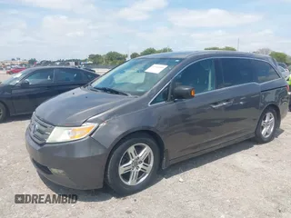 2012 Honda Odyssey Touring with VIN 5FNRL5H90CB088536, listed as a IAAI auction lot 42102008 with 283,350 mi miles and . Bid and sale history available at DreamBid. Image 17.