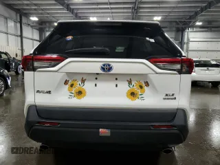 2019 Toyota RAV4 Hybrid XLE with VIN 2T3RWRFV1KW016526, listed as a Copart auction lot 61466435 with 64,255 mi miles and Salvage title. Bid and sale history available at DreamBid. Image 6.