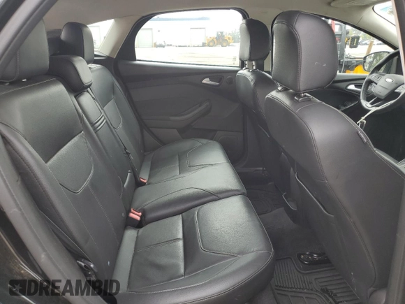 2015 Ford Focus Titanium z VIN 1FADP3N25FL324390, wystawiony jako Copart lot #59801805 z przebiegiem 97 615 mil mil oraz Szkoda całkowita • Salvage title. Historia ofert i sprzedaży dostępna na DreamBid. Obrazek 10.
