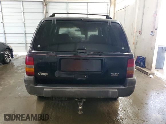 1996 Jeep Grand Cherokee Laredo with VIN 1J4GZ58S0TC402024, listed as a Copart auction lot 65074774 with 163,477 mi miles and Salvage Title. Bid and sale history available at carsss.com. Image 6.
