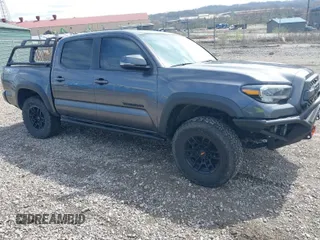 2021 Toyota Tacoma 4WD SR with VIN 3TYCZ5AN0MT039883, listed as a IAAI auction lot 41974378 with 92,082 mi miles. Bid and sale history available at carsss.com. Image 1.