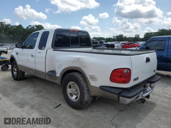 2003 Ford F-150 XL with VIN 1FTRX07W13KC28871, listed as a Copart auction lot 59003245 with 180,197 mi miles and Salvage title. Bid and sale history available at DreamBid. Image 2.