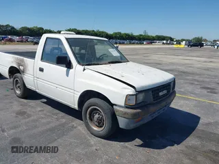 1994 Isuzu Pickup S z VIN JAACL11LXR7217702, wystawiony jako IAAI lot #41761090 z przebiegiem 198 468 mil mil oraz . Historia ofert i sprzedaży dostępna na DreamBid. Obrazek 1.