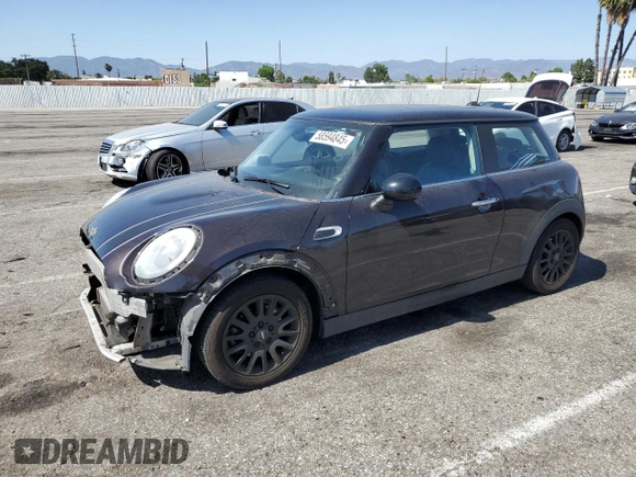 2014 MINI Hardtop with VIN WMWXM5C57ET934120, listed as a Copart auction lot 58594845 with 115,248 mi miles and Salvage title. Bid and sale history available at DreamBid. Image 1.